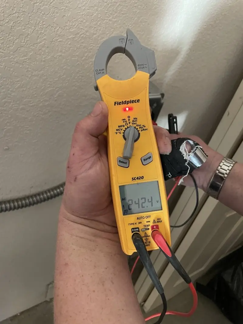 Voltage testing with clamp meter during Electrical Installation Services in Naples